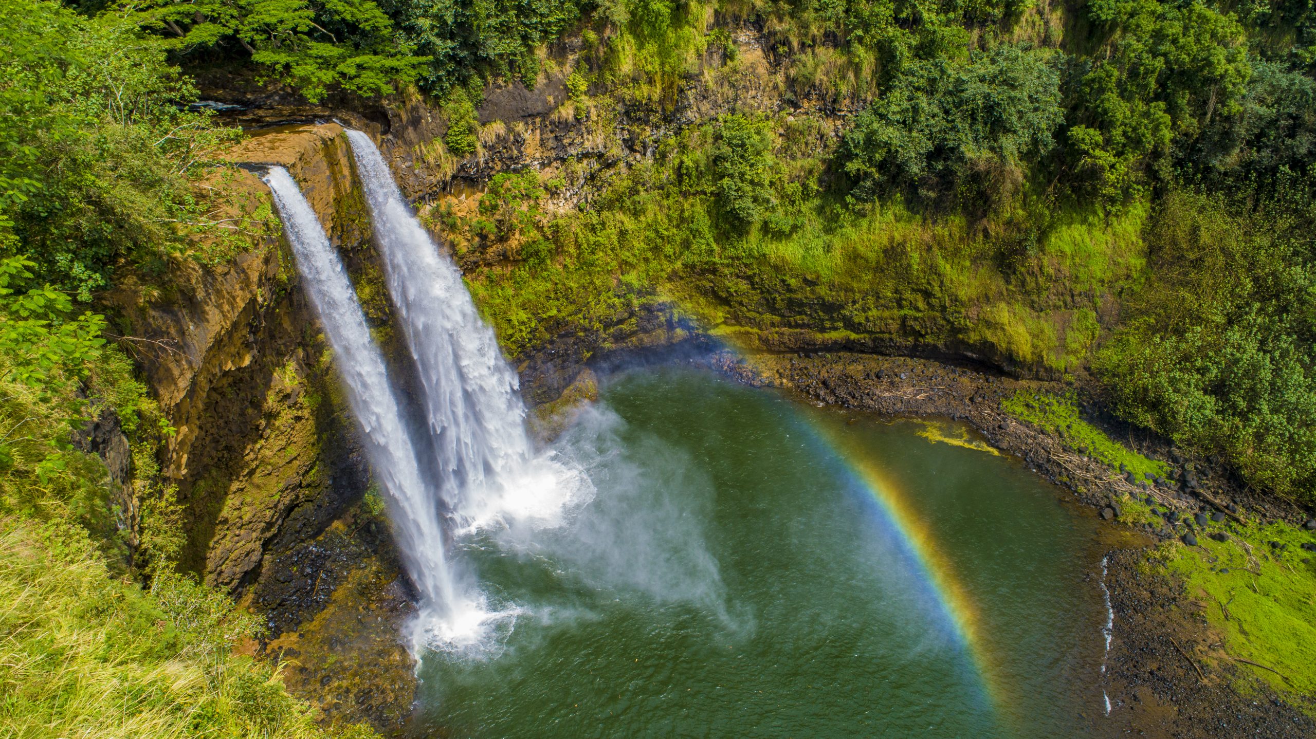 Drone aerial photography example showing waterfall and tropical landscape from above
