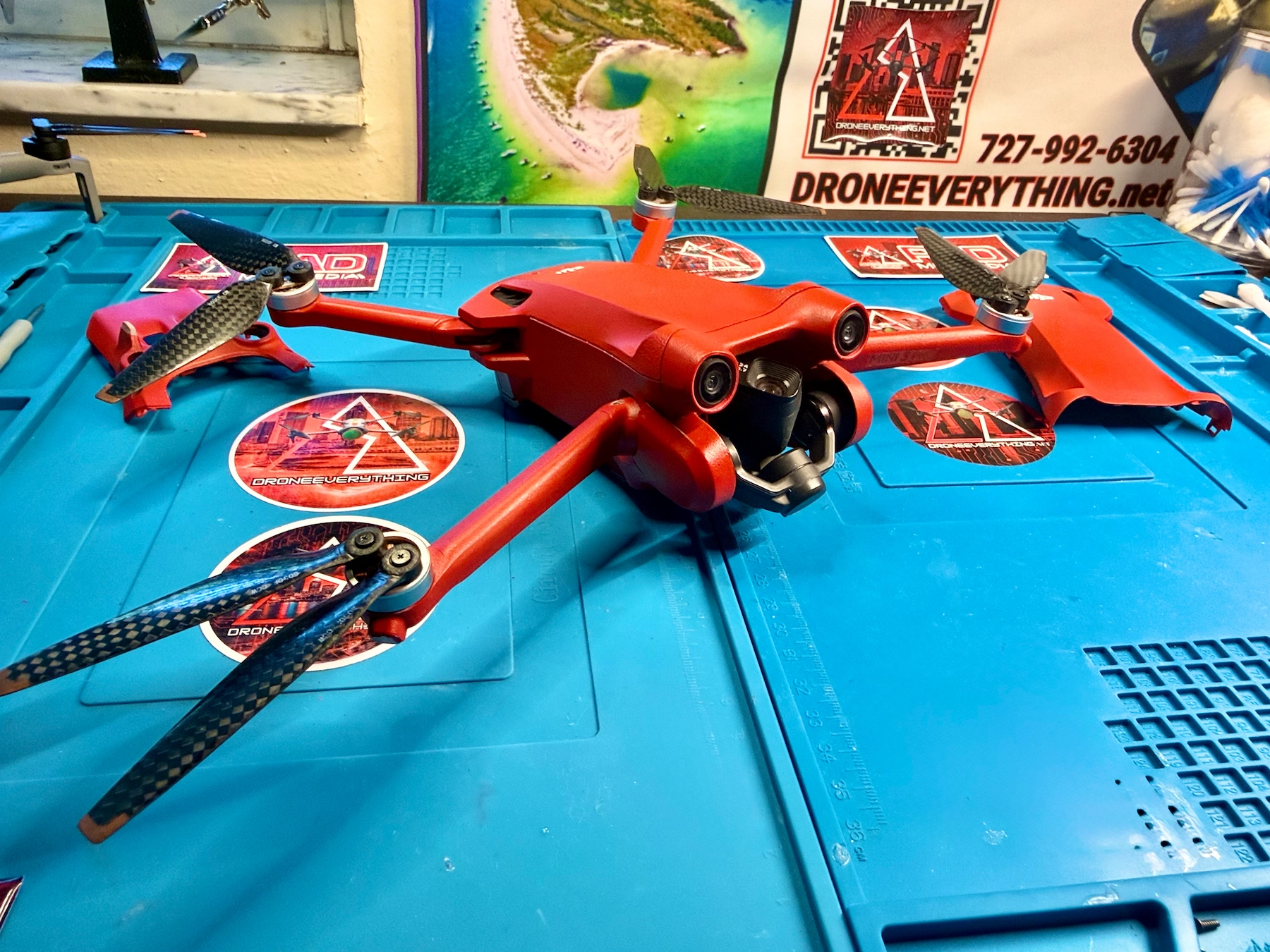 Custom painted matte red DJI Mini 3 Pro used in a DroneEverything bird behavior drone experiment
